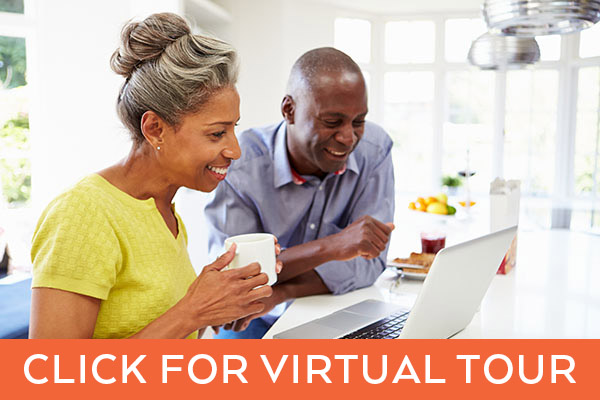 Active Adult couple on computer. Click for virtual tour